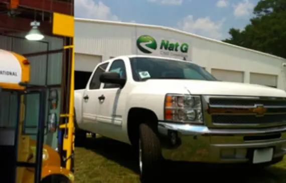 A truck parked in front of a building.